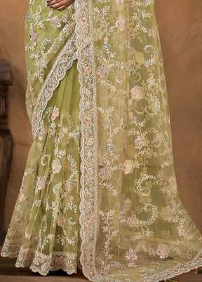 Green Net Net Saree With Blouse Piece