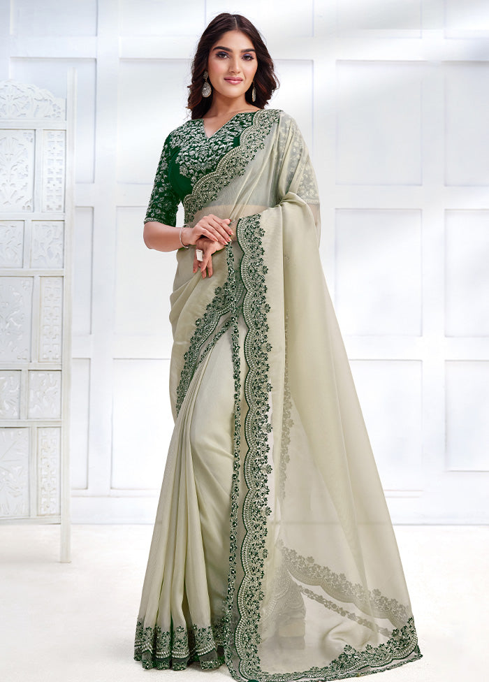 Off White Net Net Saree With Blouse Piece