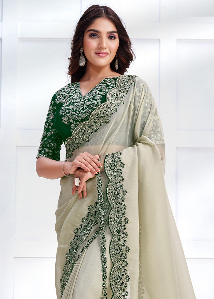 Off White Net Net Saree With Blouse Piece