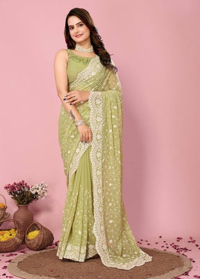 Pista Green Georgette Saree With Blouse Piece