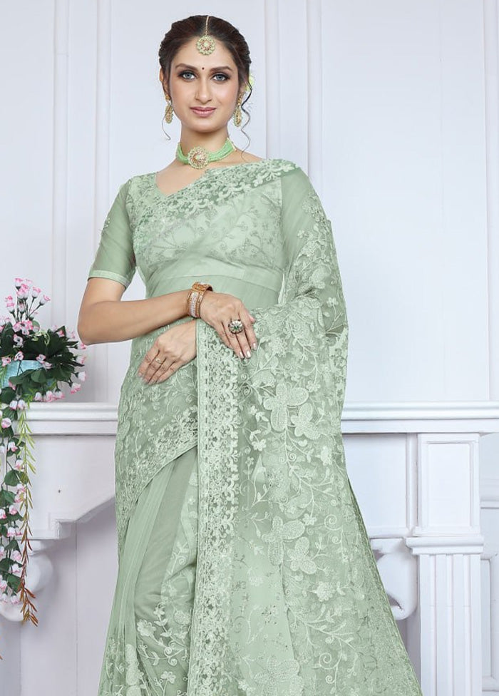 Pista Green Net Saree With Blouse Piece