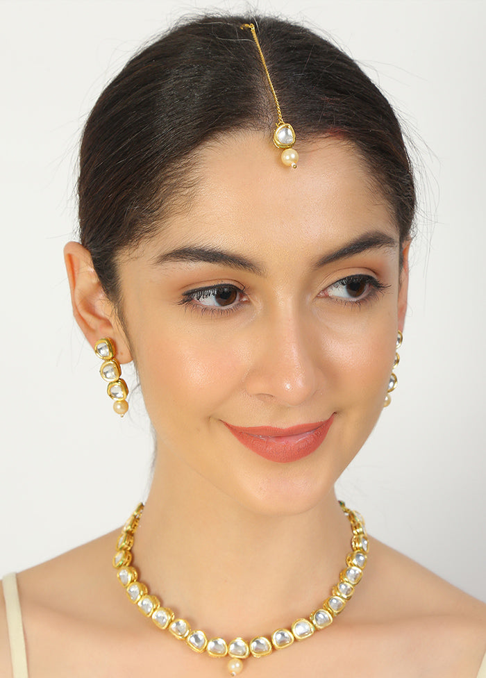Golden Kundan Work Copper And Alloy Necklace With Earrings And Mangtika